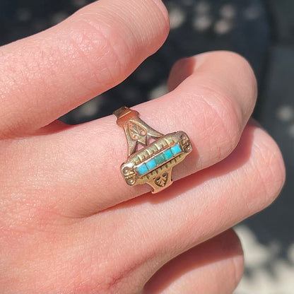 Antique yellow gold ring set with five square turquoise stones, circa 1920's.