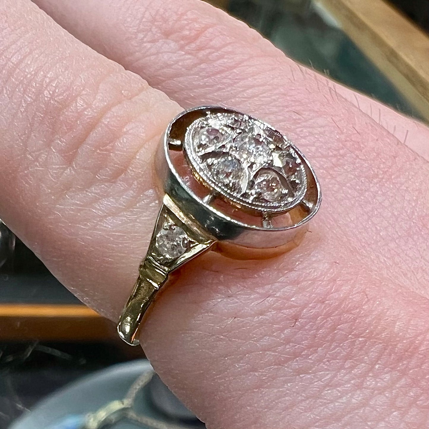 An antique yellow gold ring set with a cluster of old European cut diamonds.