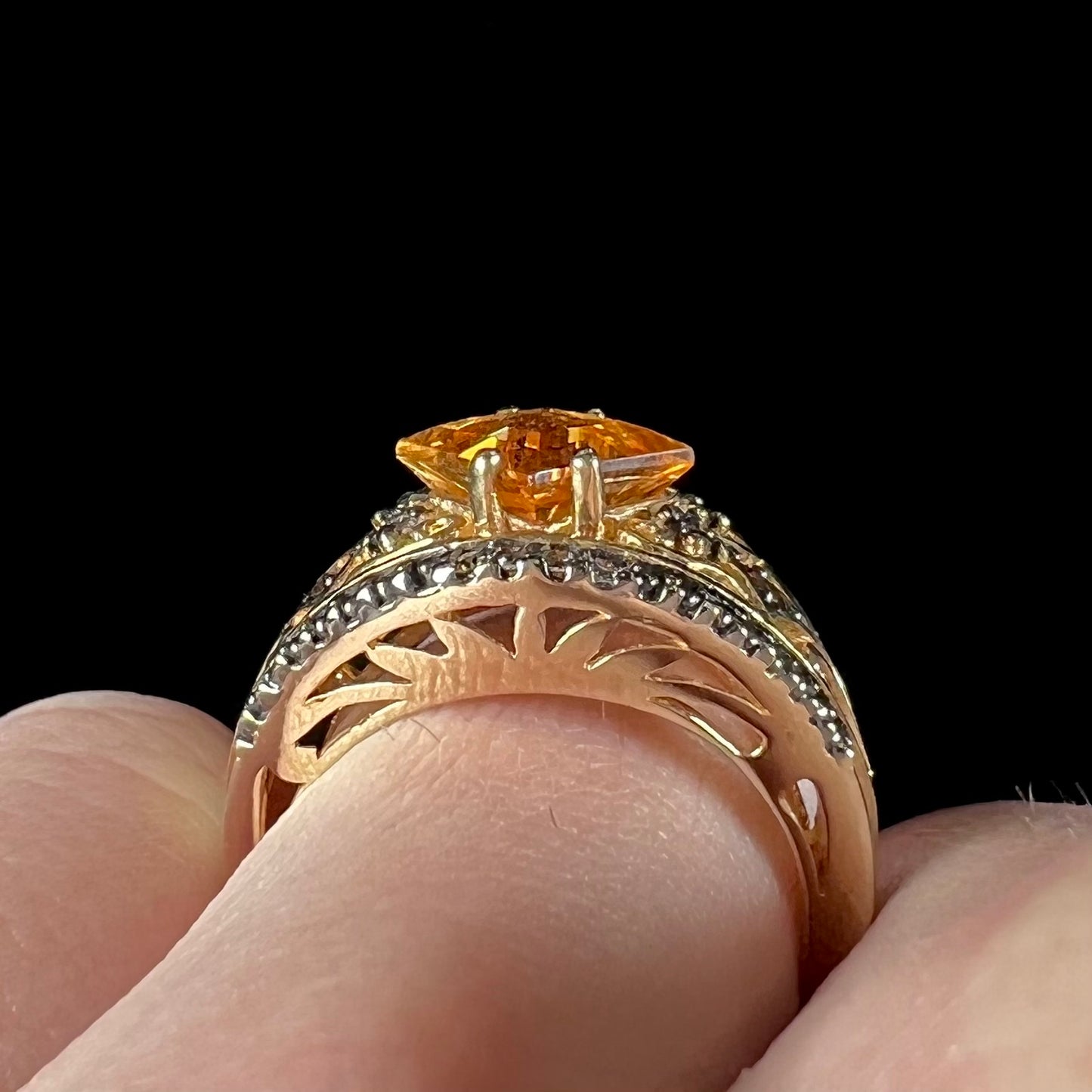 A square cut citrine and chocolate diamond filigree ring with andalusite accents.