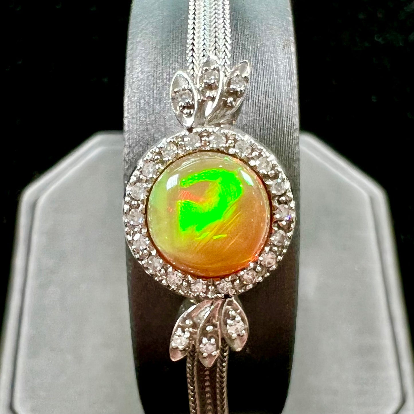 A Virgin Valley fire opal and diamond bracelet made from a vintage 1930's watch.