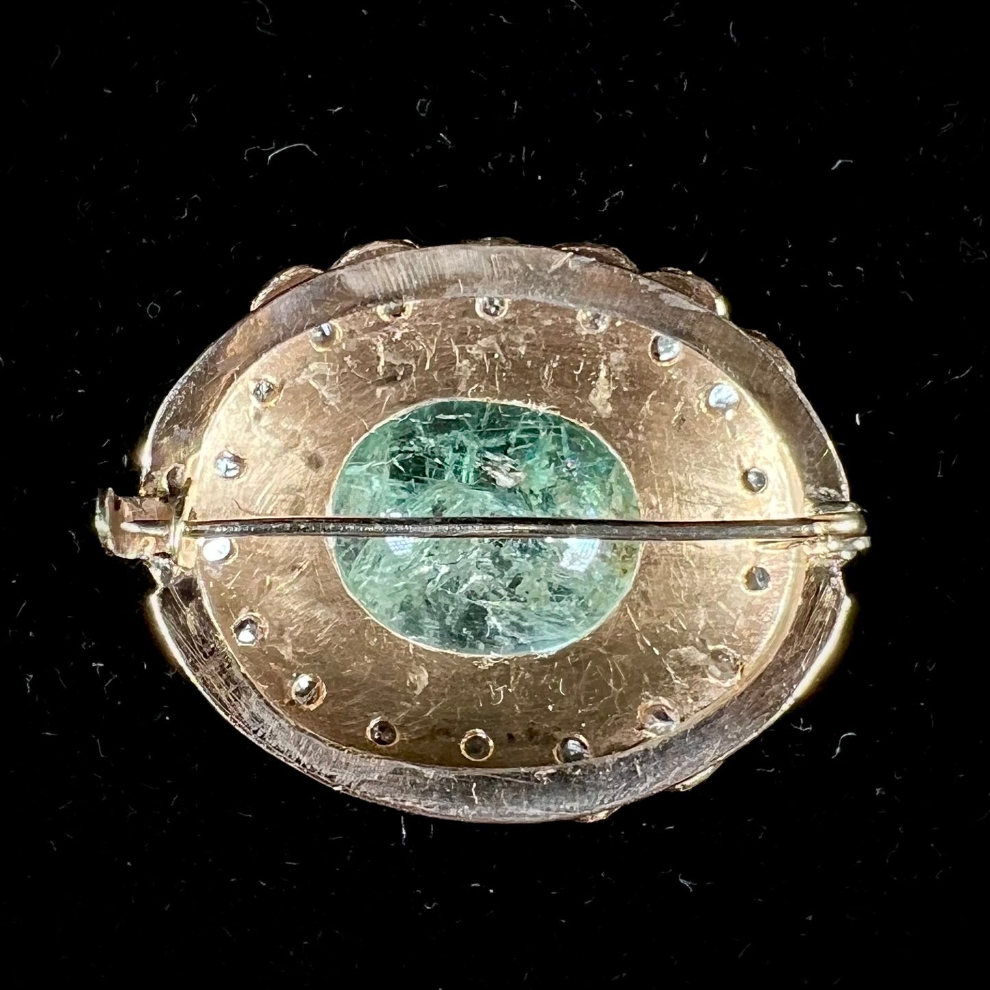 An antique 1800's Victorian emerald and diamond crystal brooch made in 18kt yellow gold.