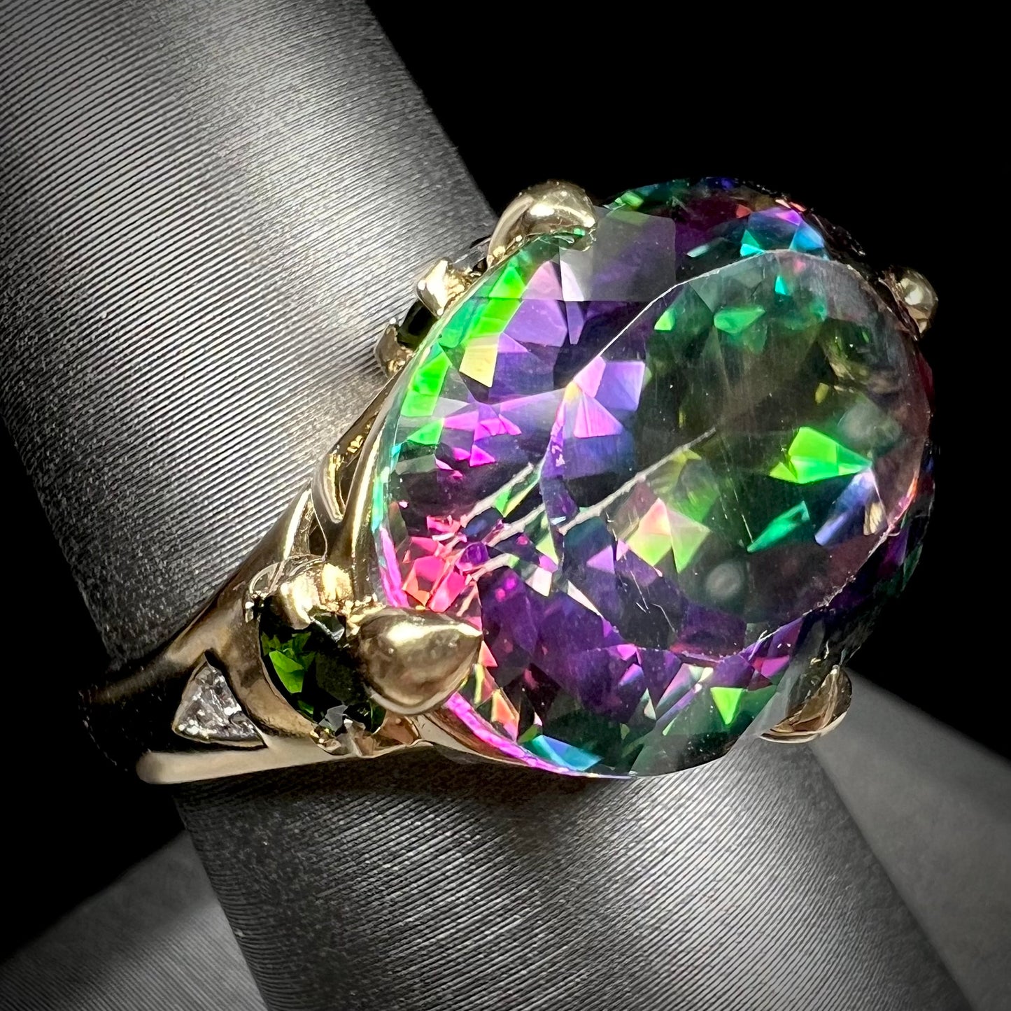 A ladies' large mystic topaz, chrome diopside, and diamond statement ring cast in 14k yellow gold.