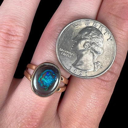 A natural Yowah Nut boulder opal split shank ring in 14kt yellow gold.