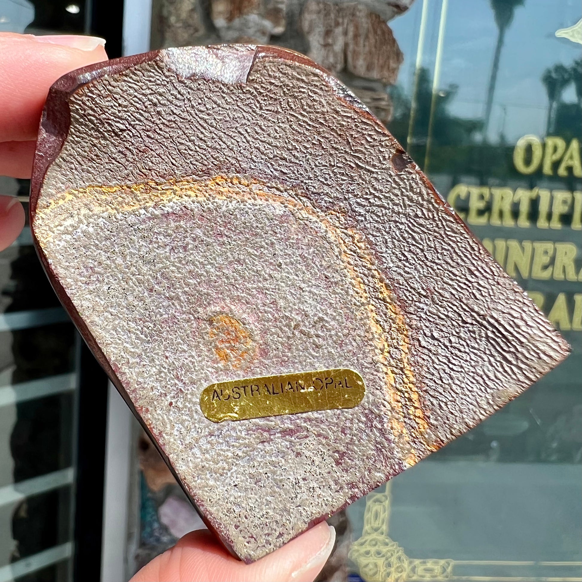 A polished piece of boulder opal stone from Koroit, Australia.