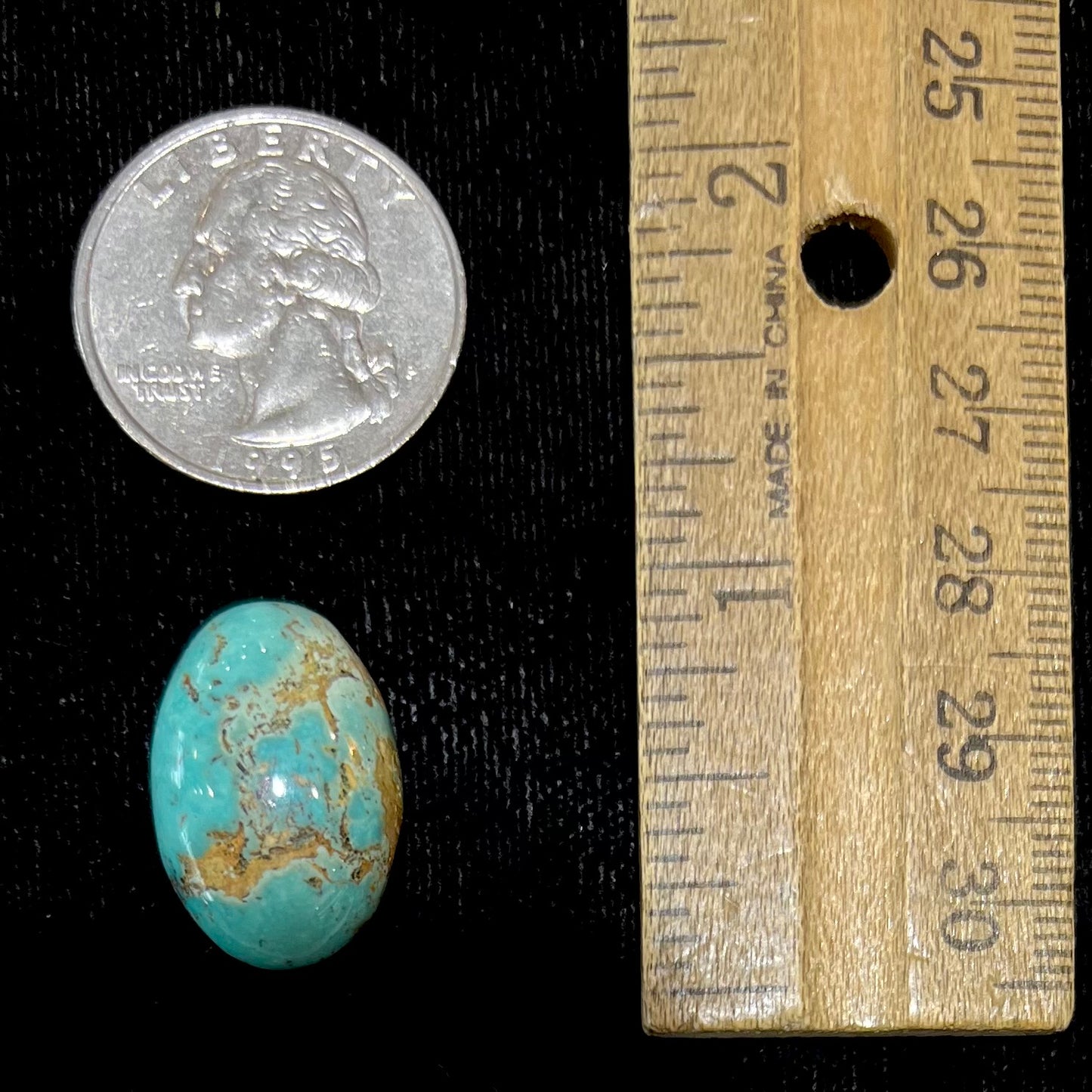 An oval cabochon cut loose Fox turquoise stone.