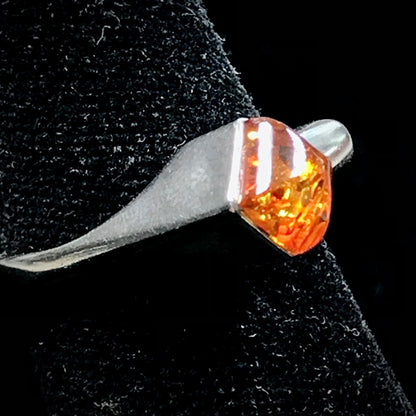 Square shaped Baltic Amber cabochon set in a unique sterling silver ring.