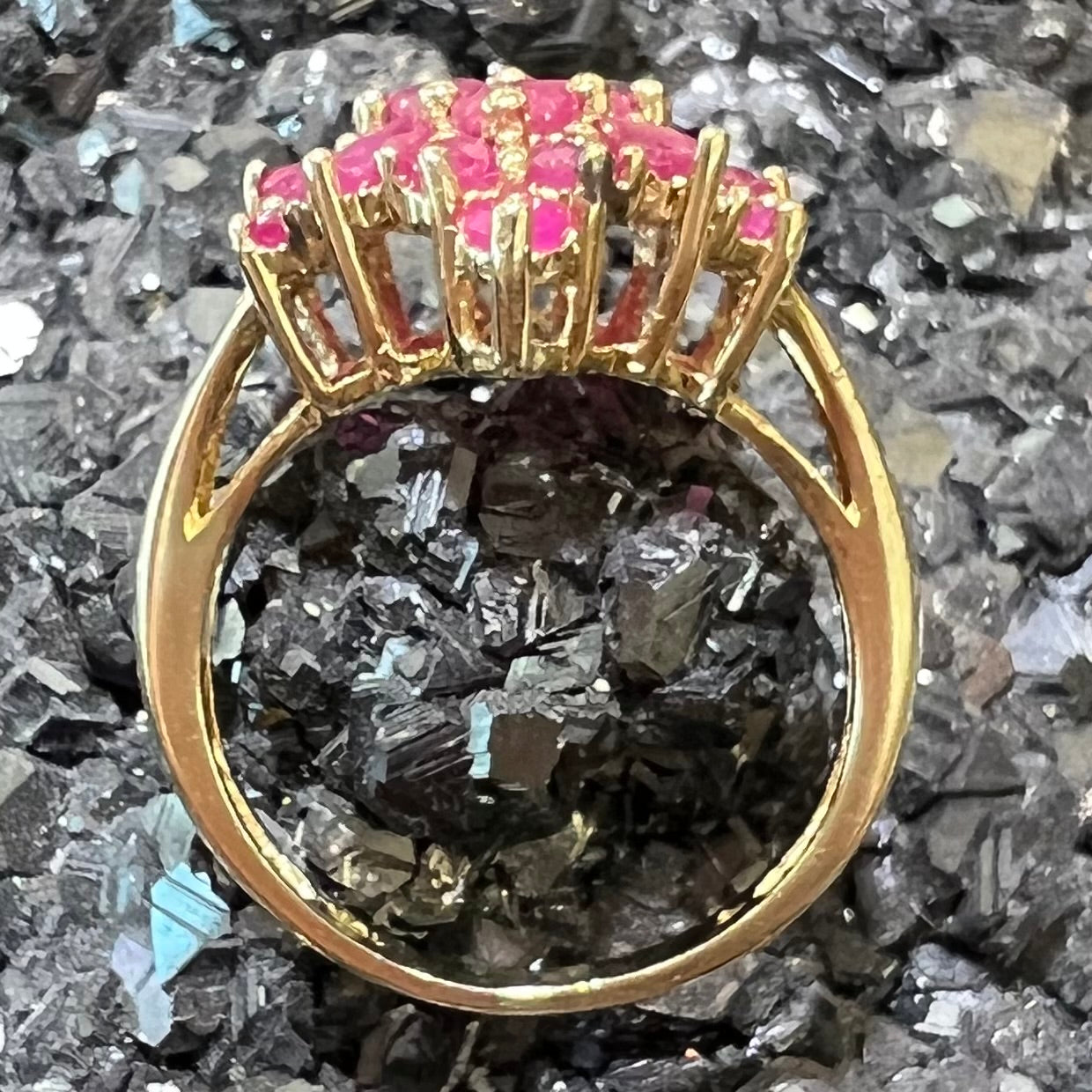 Burma ruby cluster ring set in 14 karat yellow gold.