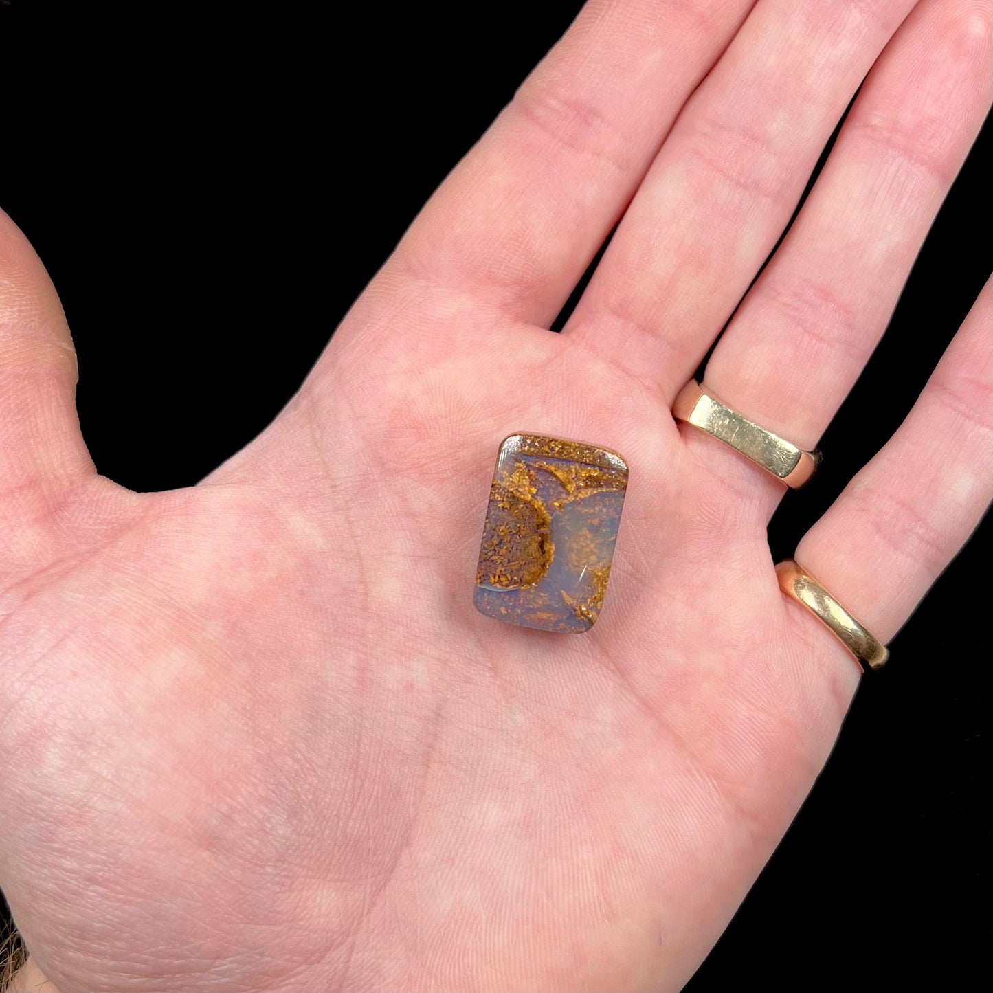 A polished, drilled pipe boulder opal bead.