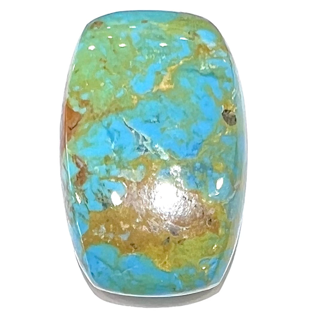A loose, barrel cabochon cut turquoise stone from Manassa, Colorado.  The piece is blue with yellow matrix.