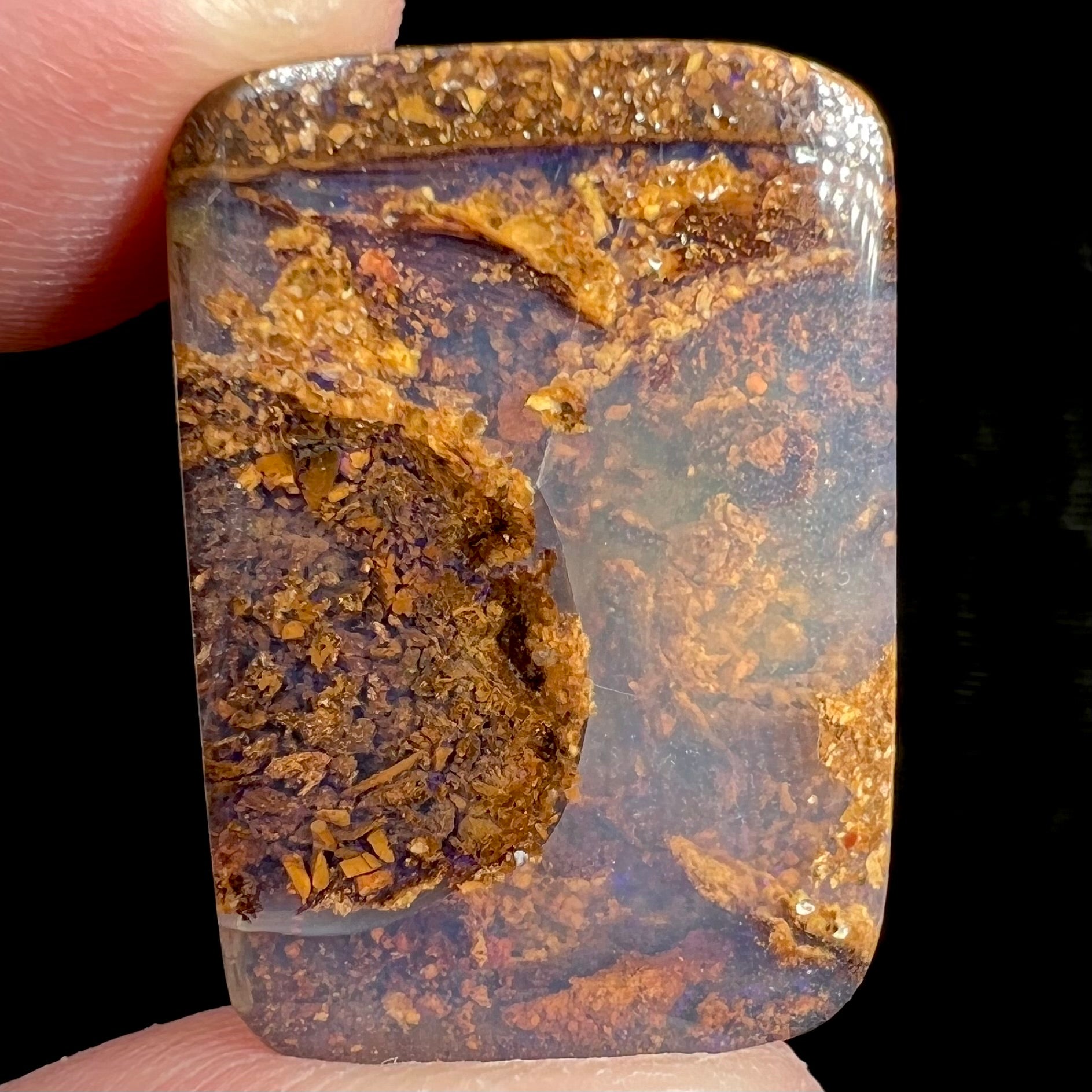 A polished, drilled pipe boulder opal bead.