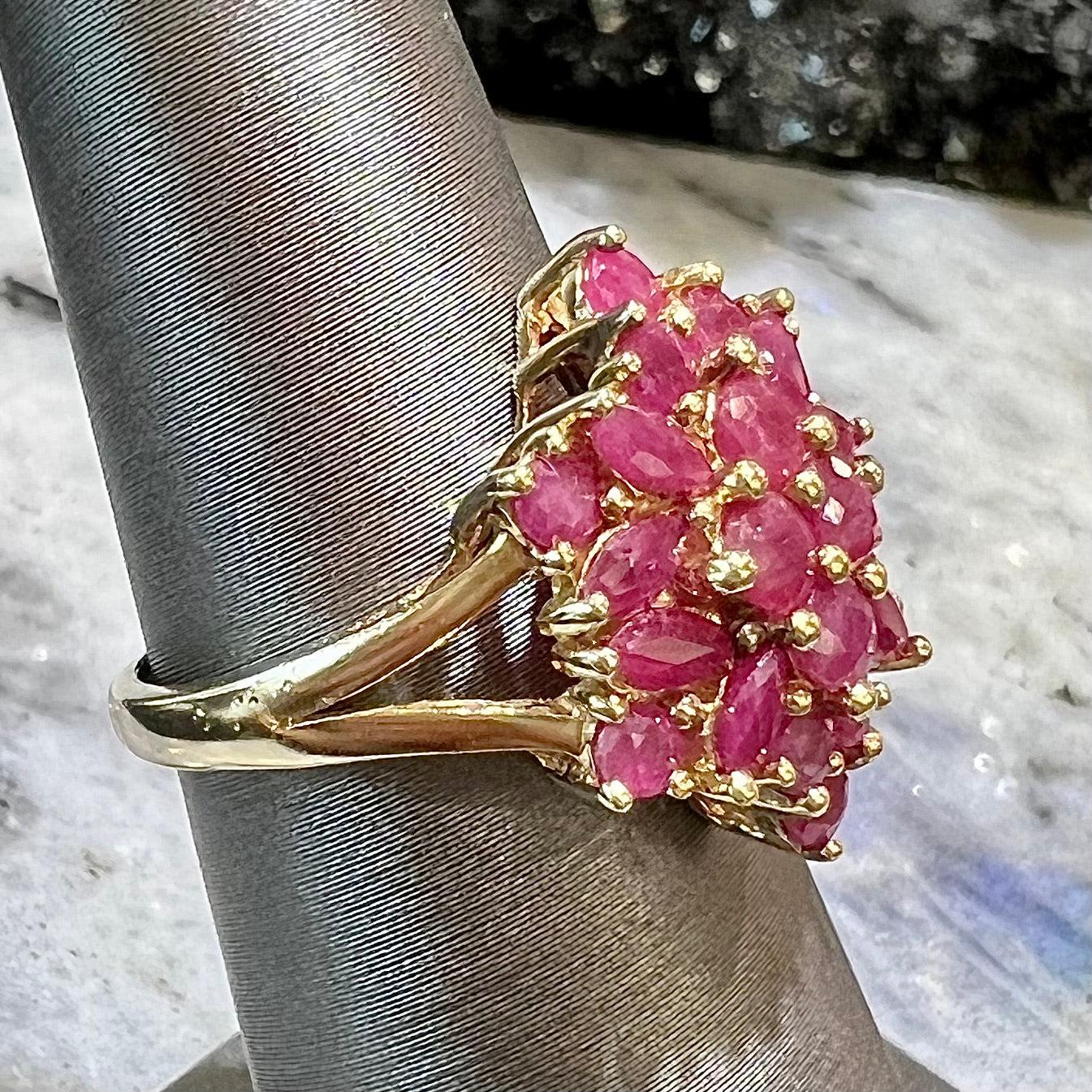 Burma ruby cluster ring set in 14 karat yellow gold.