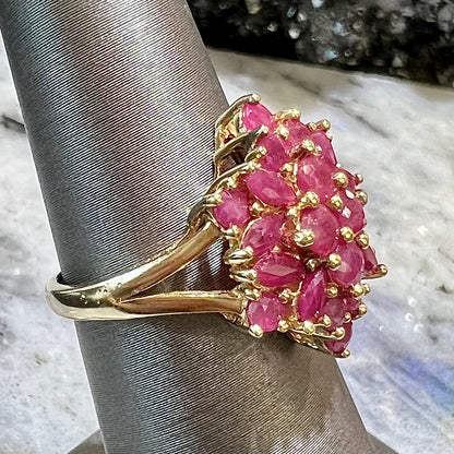 Burma ruby cluster ring set in 14 karat yellow gold.