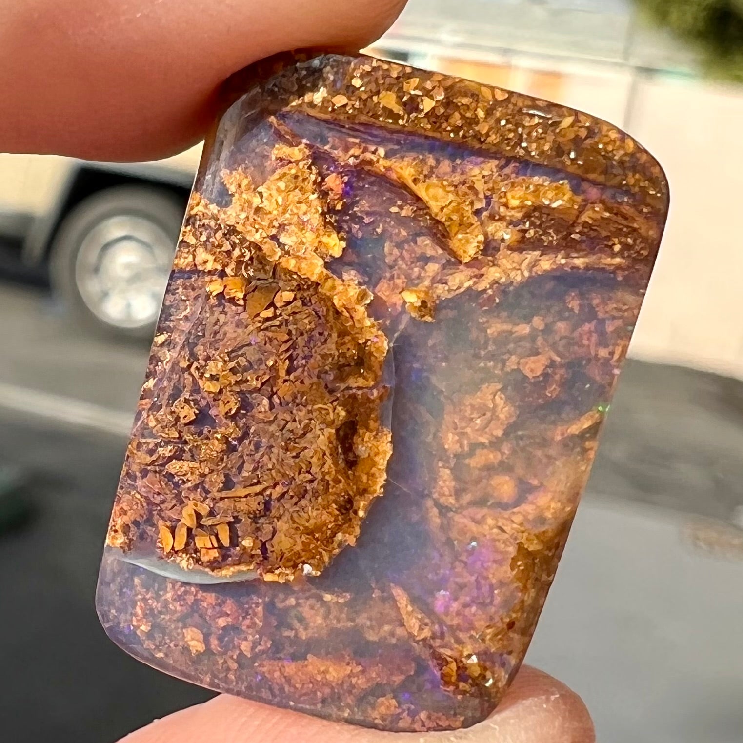 A polished, drilled pipe boulder opal bead.