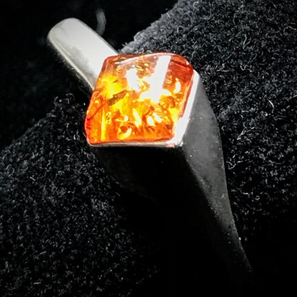 Square shaped Baltic Amber cabochon set in a unique sterling silver ring.