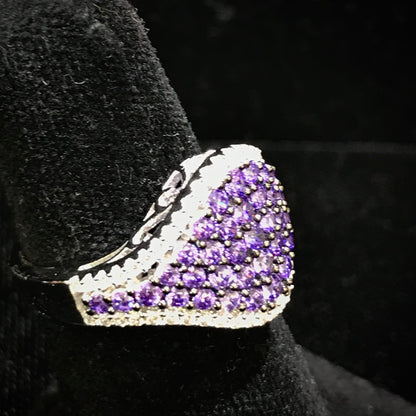 Purple synthetic ring set in sterling silver with white mele halo stones.