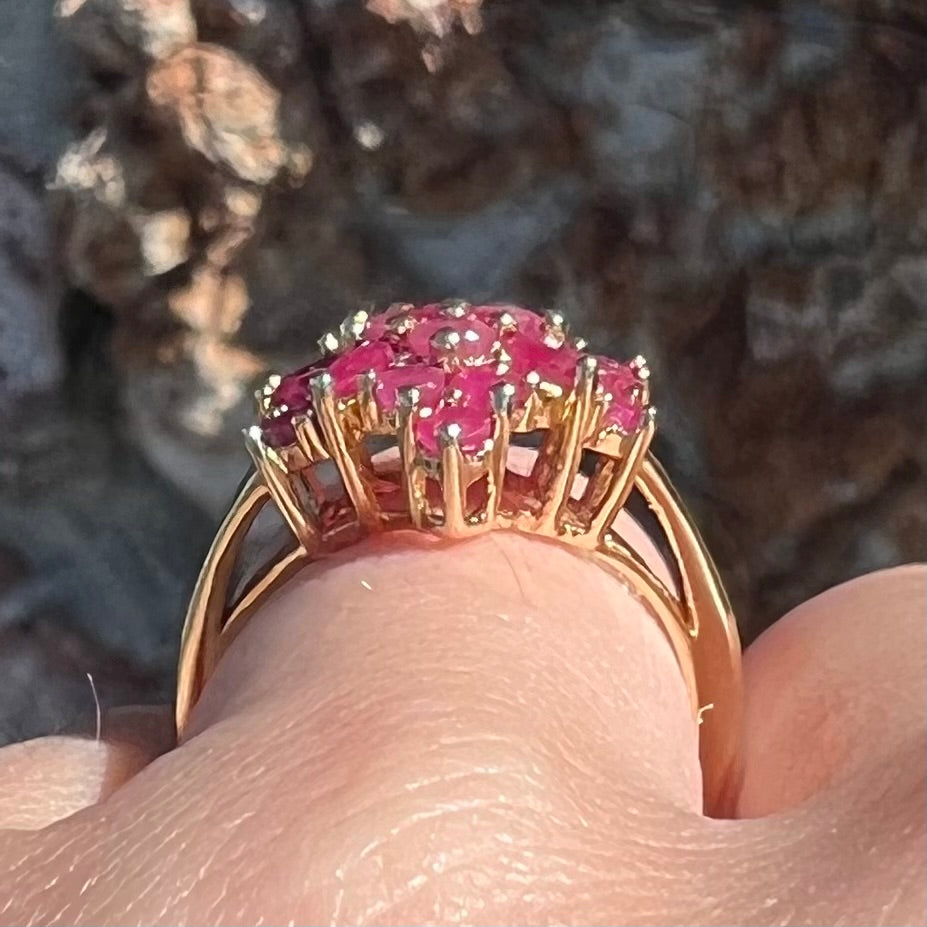 Burma ruby cluster ring set in 14 karat yellow gold.