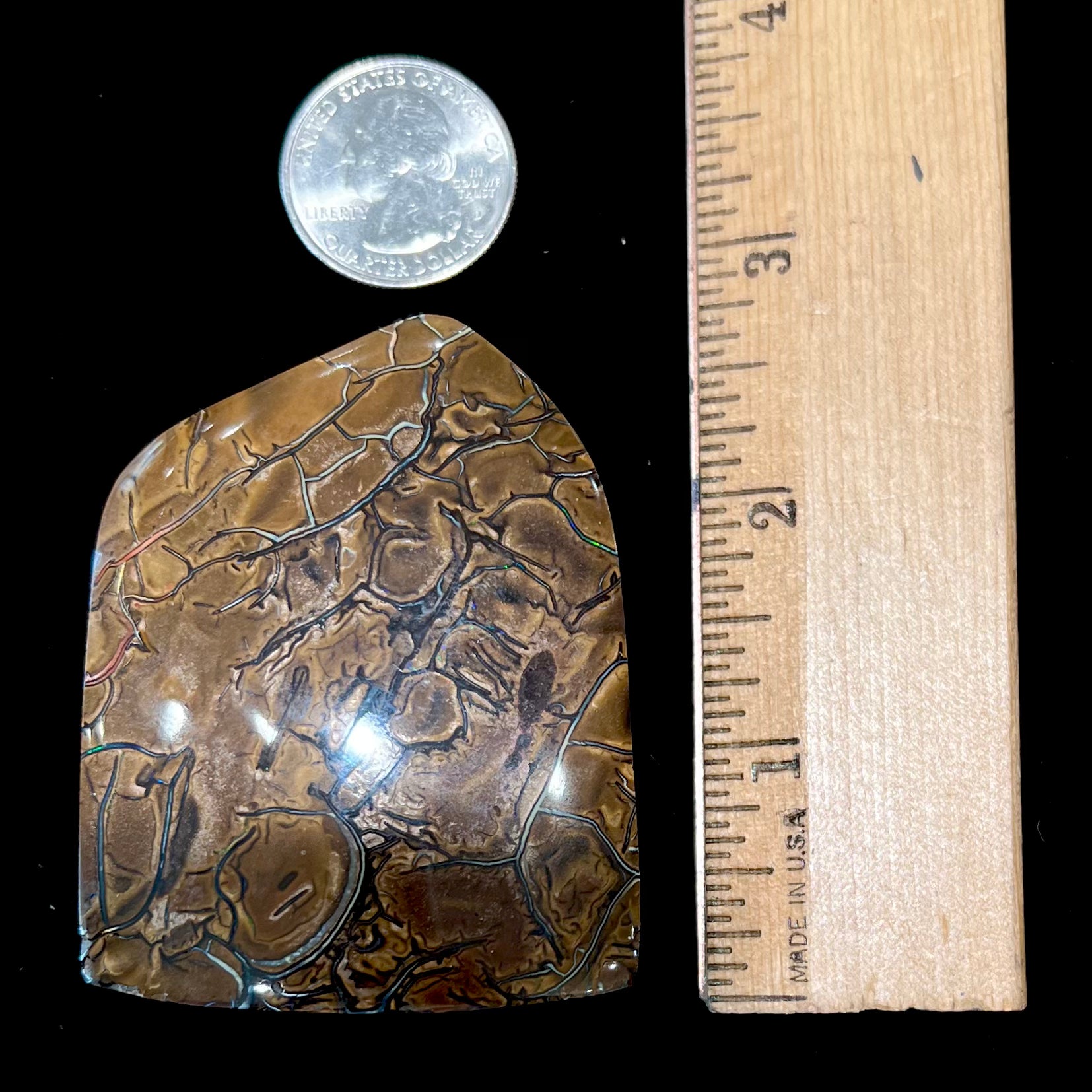 A polished piece of boulder opal stone from Koroit, Australia.