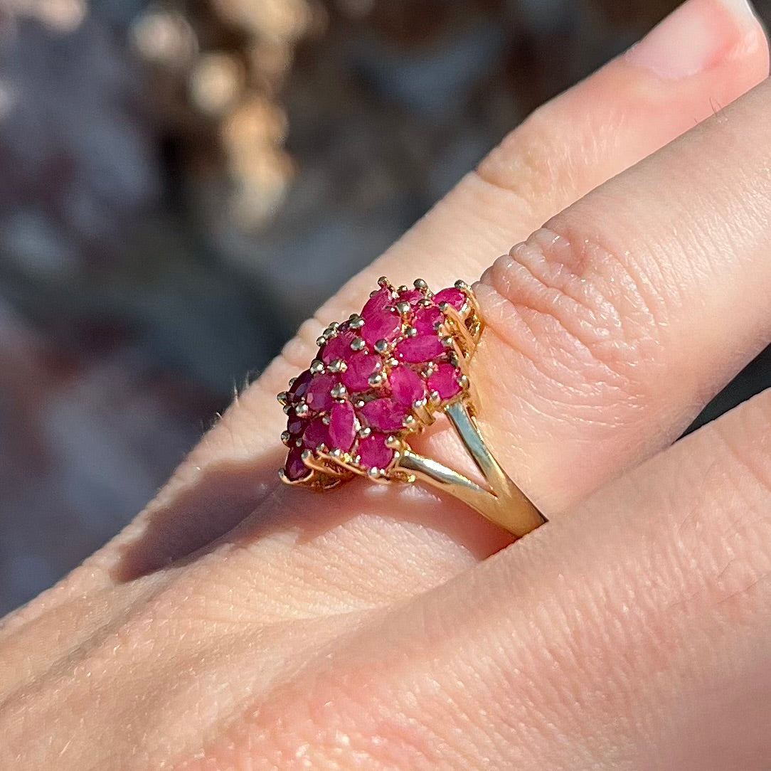 Burma ruby cluster ring set in 14 karat yellow gold.