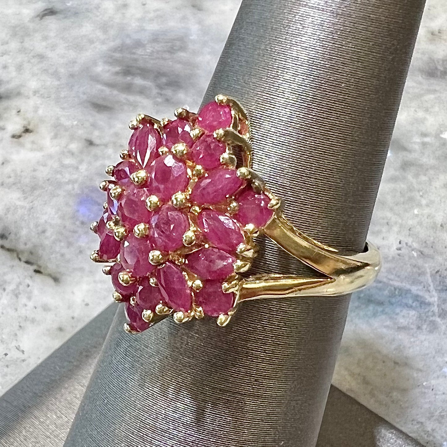 Burma ruby cluster ring set in 14 karat yellow gold.