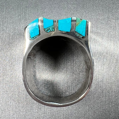 A men's turquoise ring inlay set with four turquoise stones.