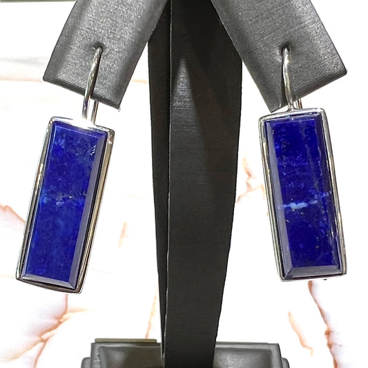 Rectangular cut lapis lazuli stones bezel set in sterling silver wire earrings.