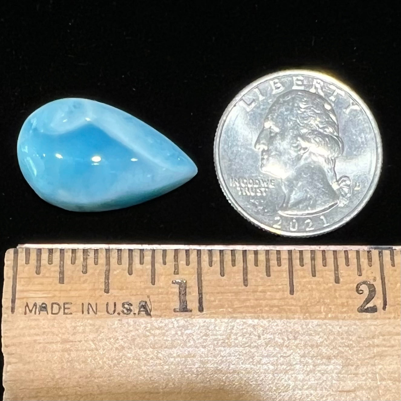A loose, pear shaped, cabochon cut larimar stone from Dominican Republic.