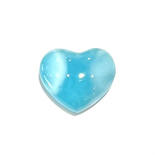 A loose, heart shaped cabochon cut larimar stone.