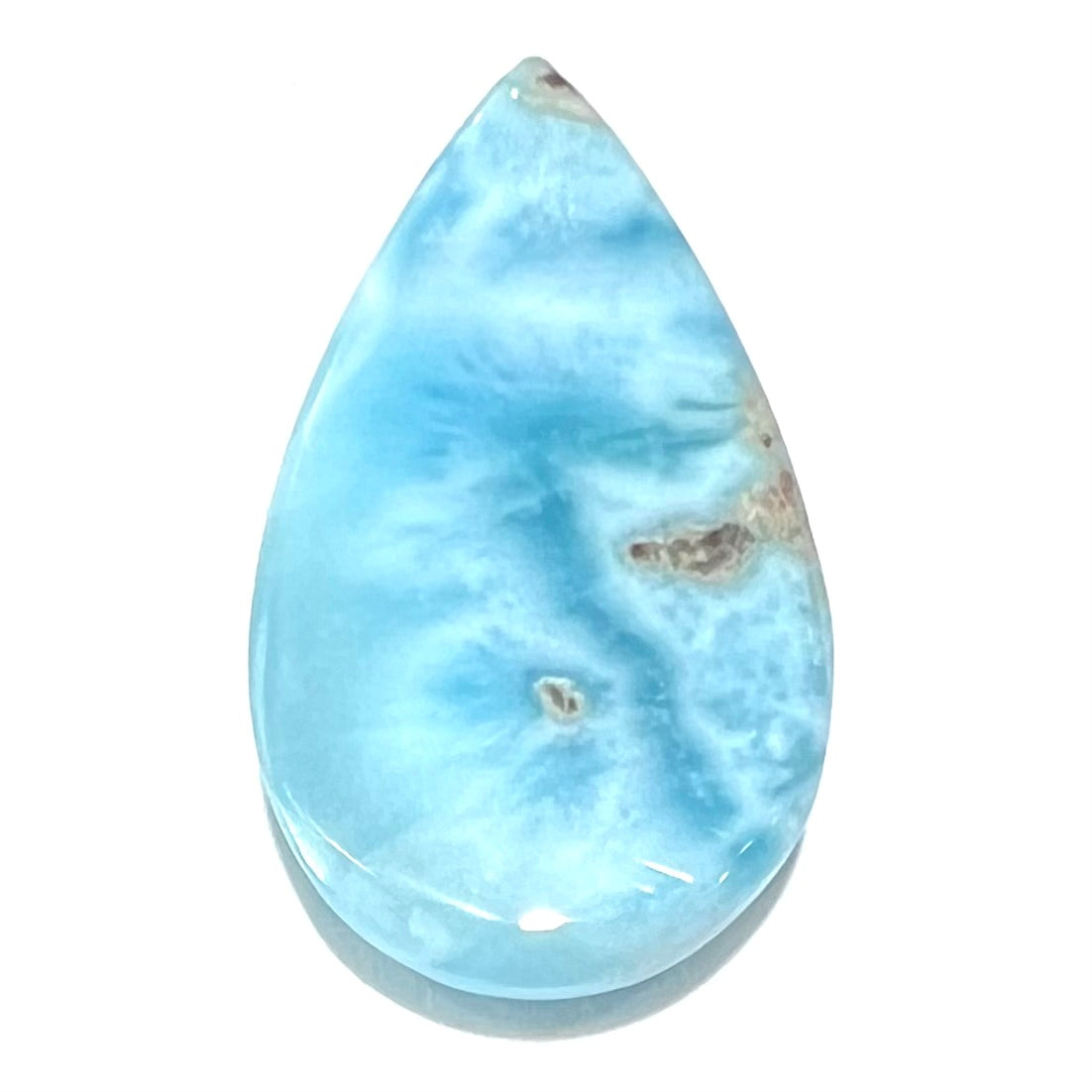 A loose, AAA+ grade, pear shaped cabochon cut blue larimar stone from Dominican Republic.