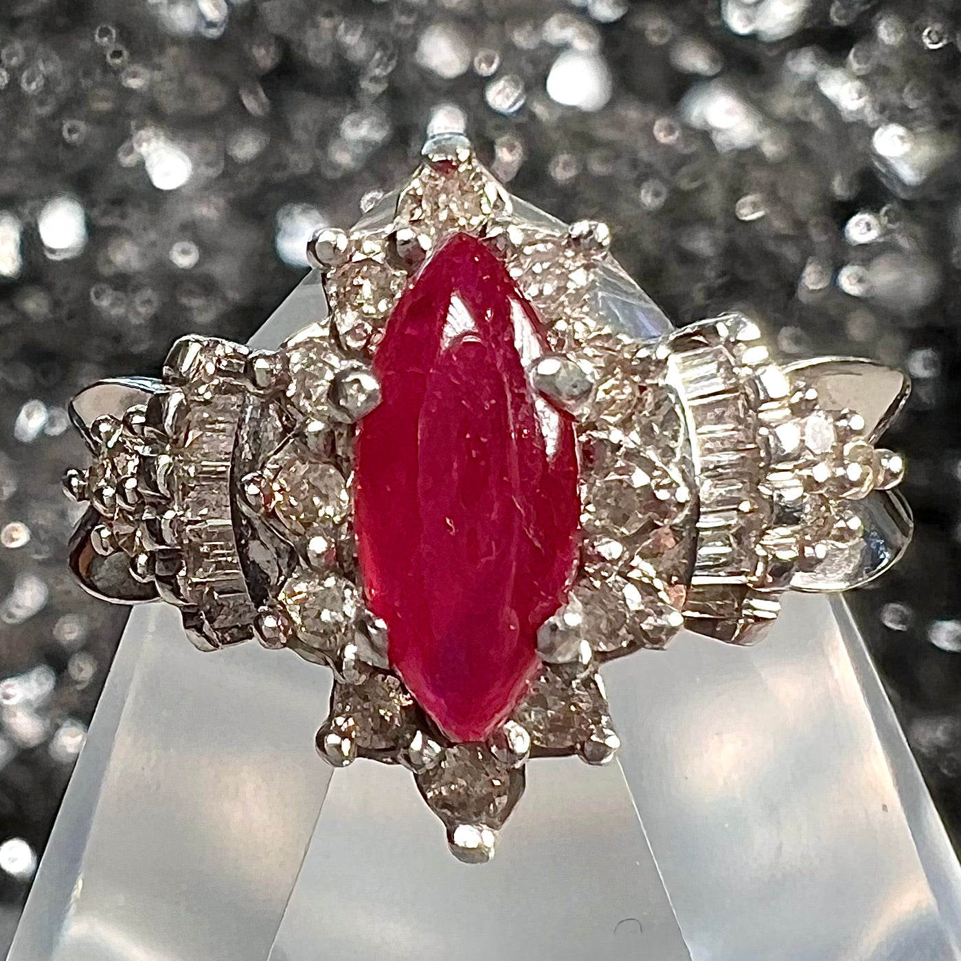 A vintage style white gold marquise cabochon cut ruby and diamond ring.