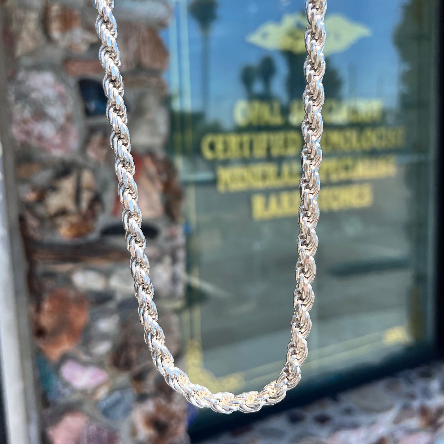 A men's 26 inch sterling silver rope chain.  The chain is stamped "925 ITALY."