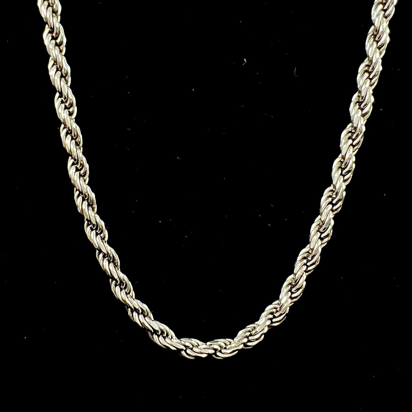 A men's sterling silver rope chain.  The chain measures 22 inches long and 4.5 millimeters wide.