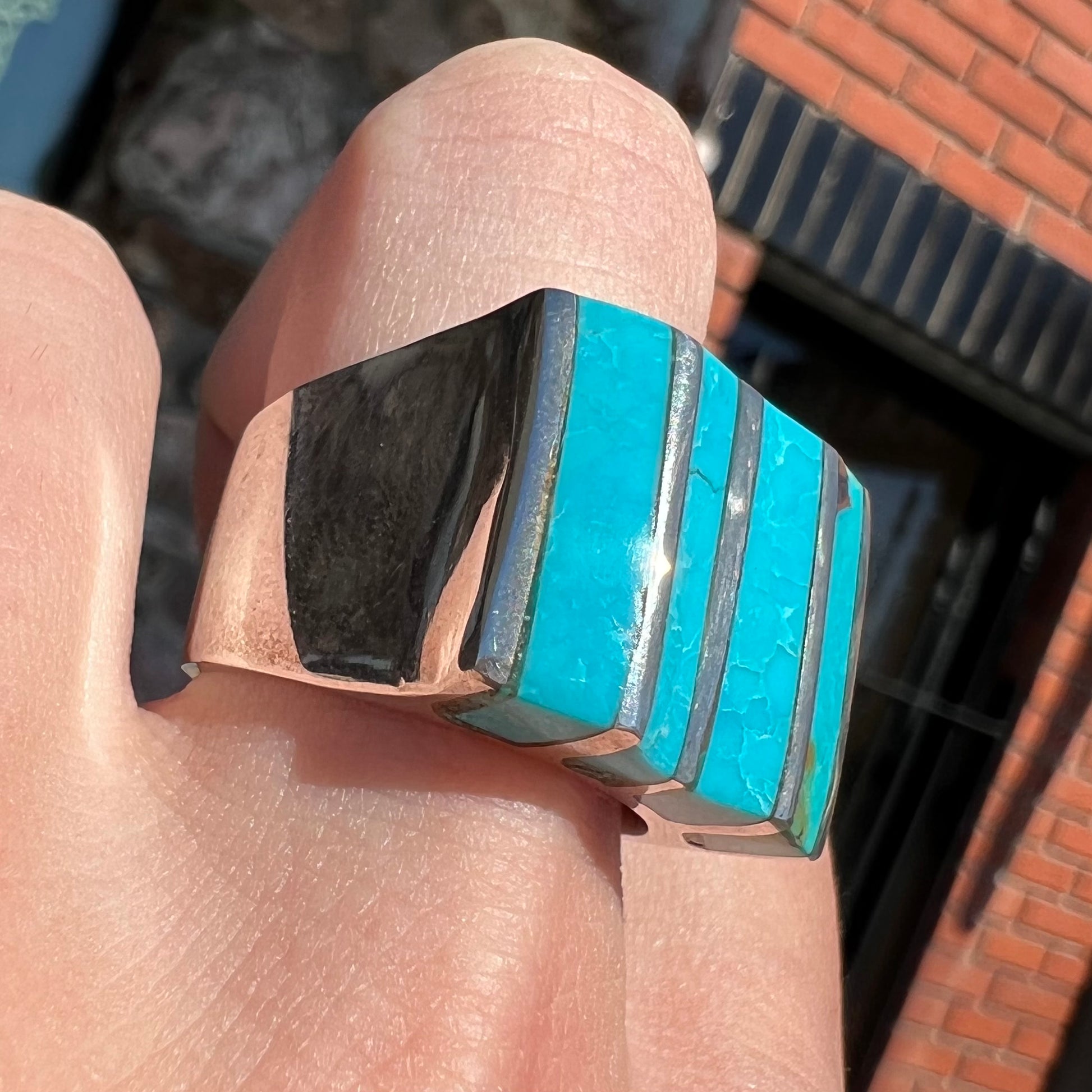 A men's turquoise ring inlay set with four turquoise stones.