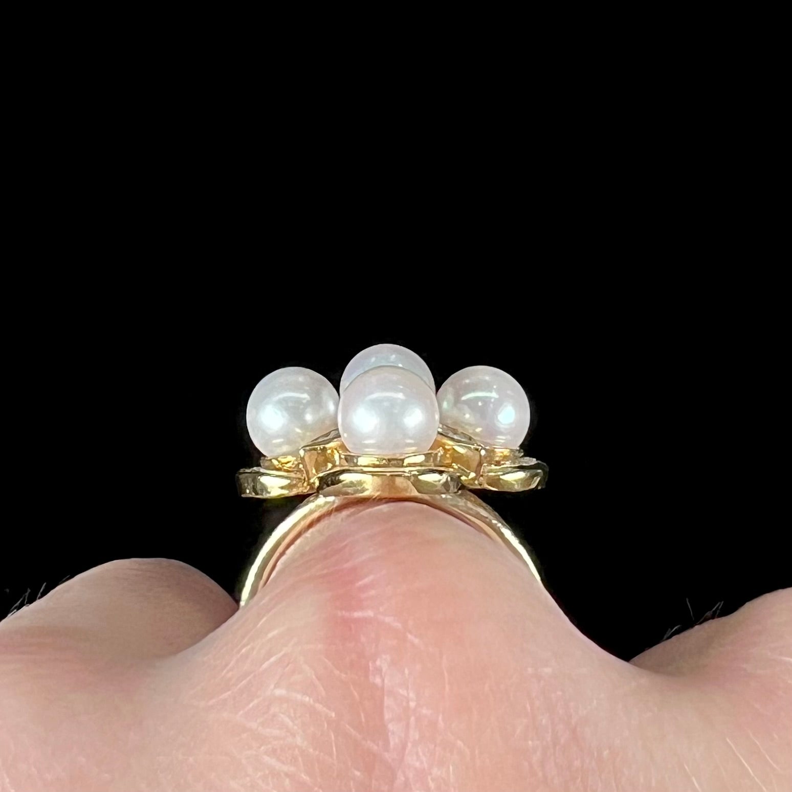 A ladies' vintage 1960's pink Akoya pearl and diamond quatrefoil ring.  The shank of the ring is textured.