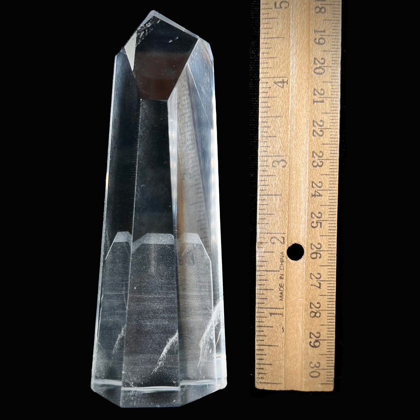 A 5.5 inch clear quartz crystal with a tabular quartz phantom inclusion.