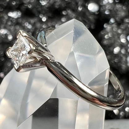 A quarter carat princess cut diamond solitaire engagement ring in white gold.