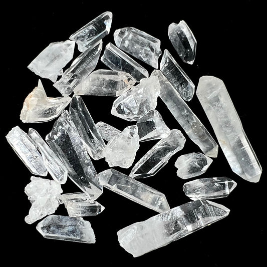 A lot of 26 small clear and white quartz crystals.