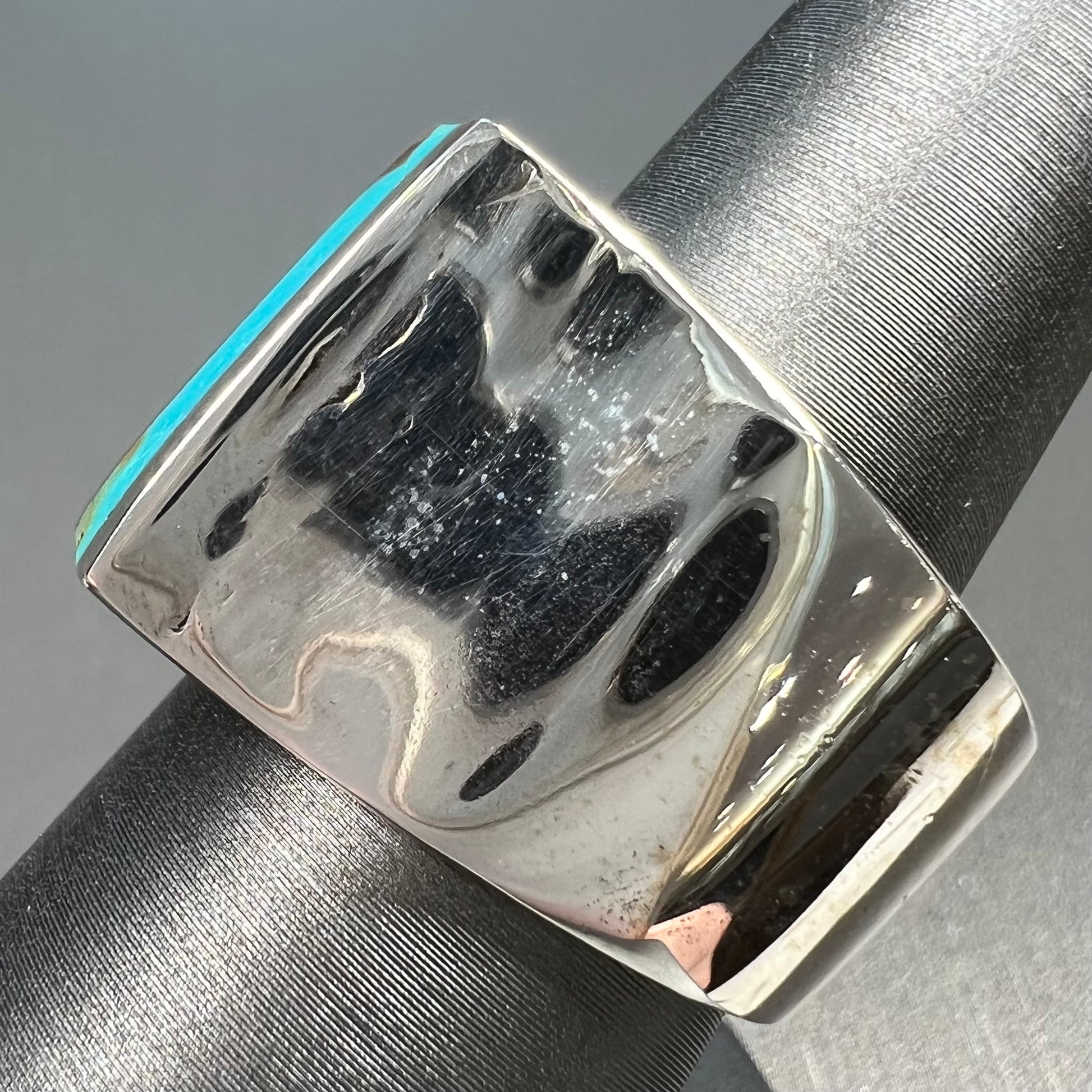 A men's turquoise ring inlay set with four turquoise stones.