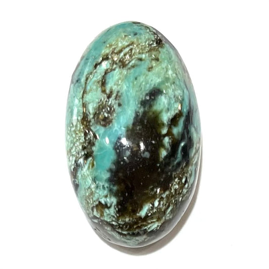 A loose, oval cabochon cut Royston turquoise stone from Nevada.