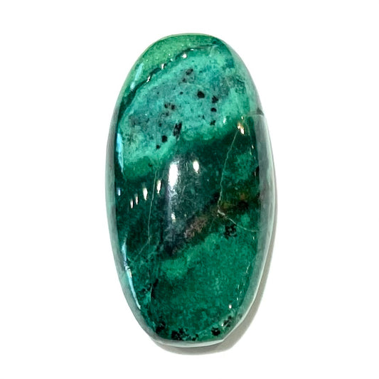 A loose, green turquoise cabochon from Royston District, Nevada.