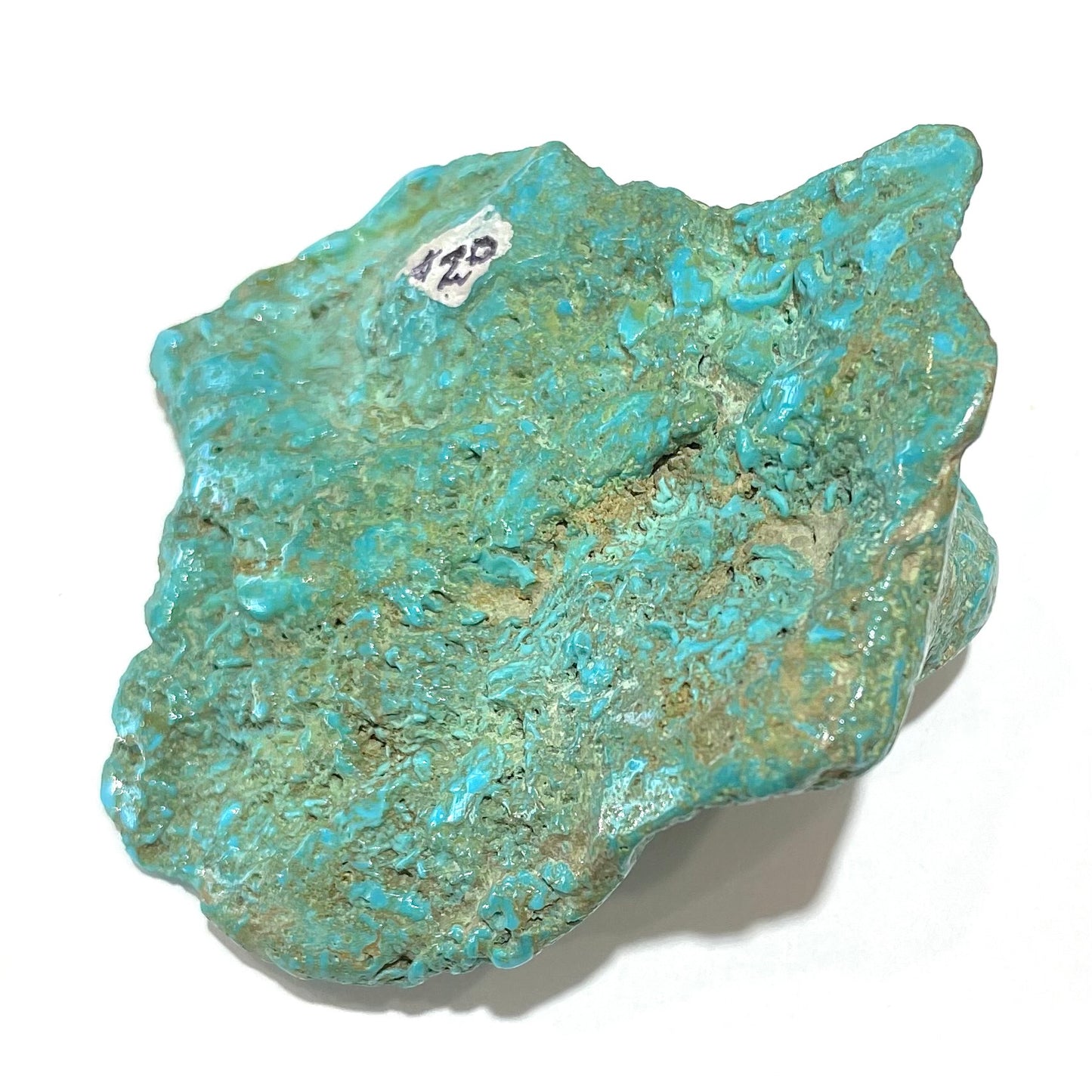 A loose, slightly polished natural turquoise nugget from Sleeping Beauty Mine, Arizona.