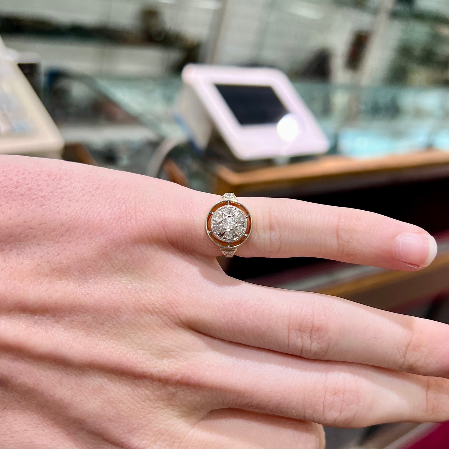 An antique yellow gold ring set with a cluster of old European cut diamonds.