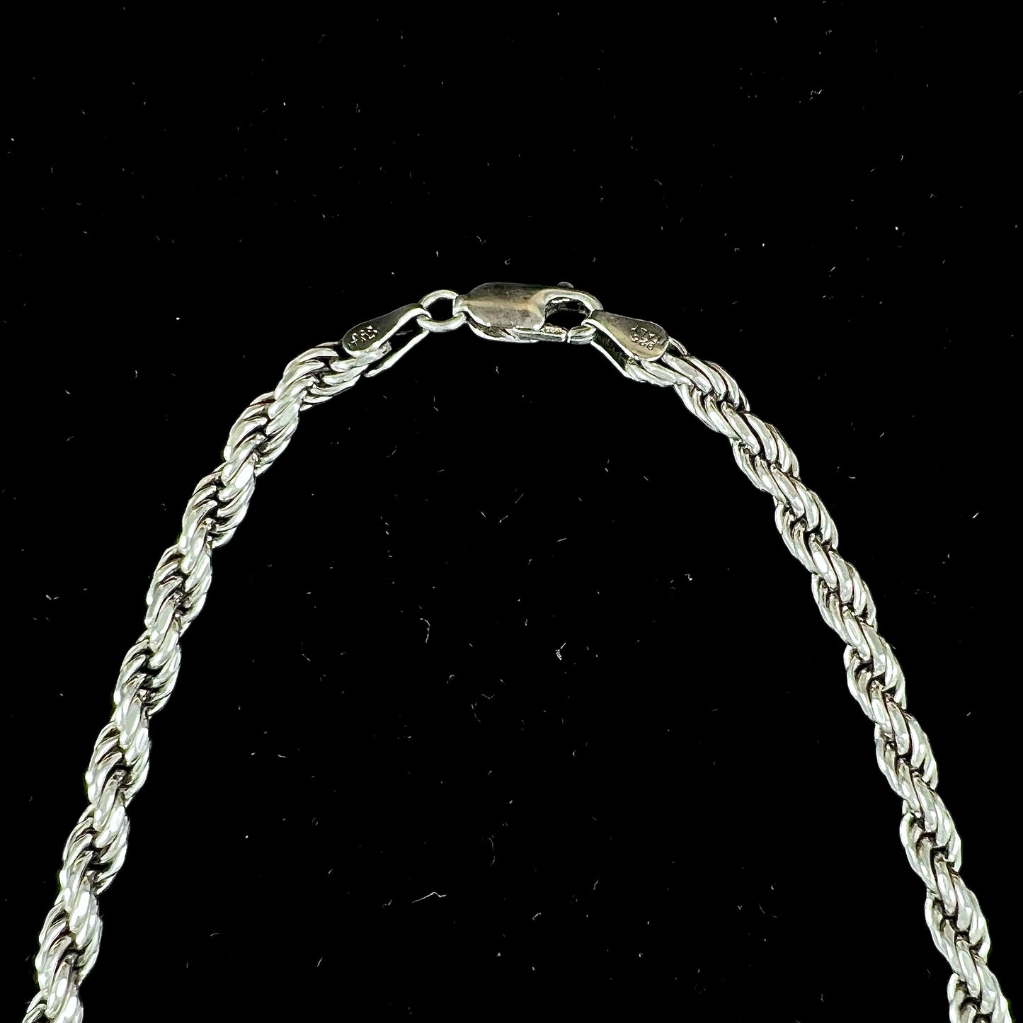 A men's sterling silver rope chain.  The chain measures 22 inches long and 4.5 millimeters wide.