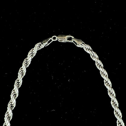 A men's sterling silver rope chain.  The chain measures 22 inches long and 4.5 millimeters wide.