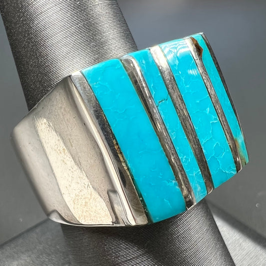 A men's turquoise ring inlay set with four turquoise stones.