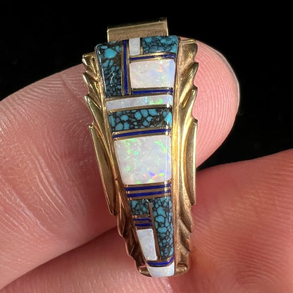 A pair of ladies' yellow gold watch cuffs inlaid with spiderweb turquoise and white crystal opal.