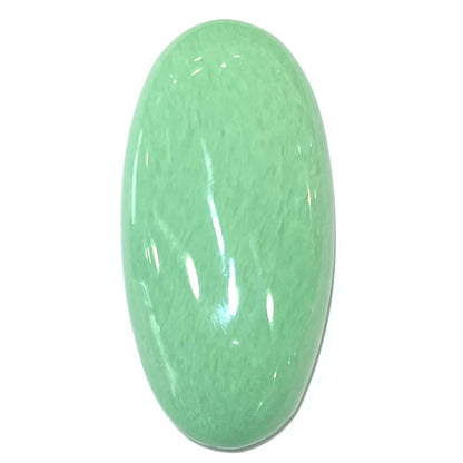 A loose, oval cabochon cut variscite stone from Utah, USA.