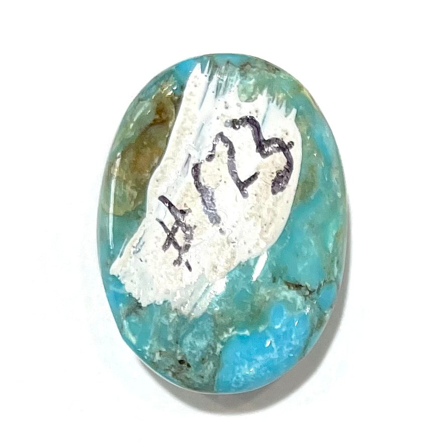 A loose, oval cabochon cut turquoise stone from the Valley Blue Mine in Lander County, Nevada.