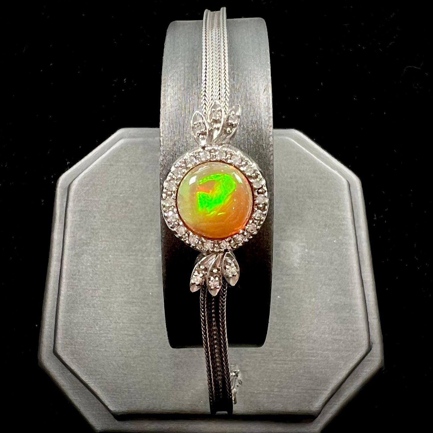 A Virgin Valley fire opal and diamond bracelet made from a vintage 1930's watch.