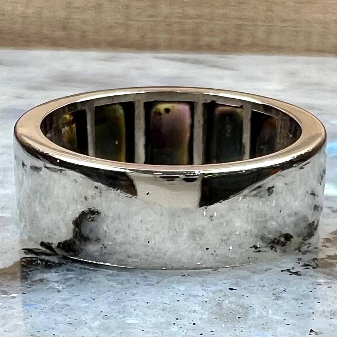 A men's Lightning Ridge black opal inlay ring cast in white gold.