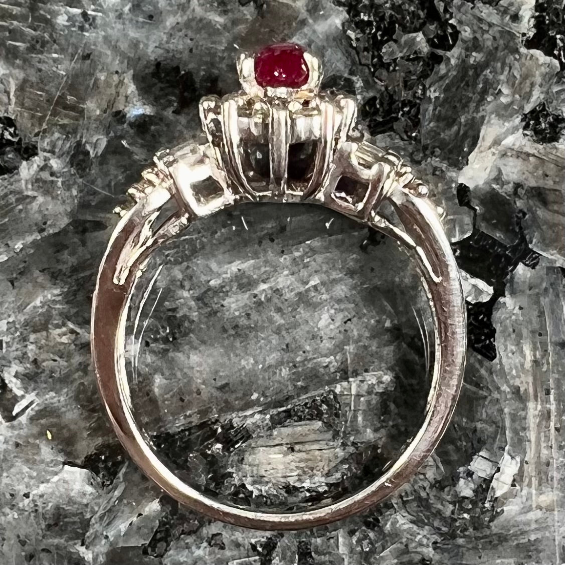 A vintage style white gold marquise cabochon cut ruby and diamond ring.